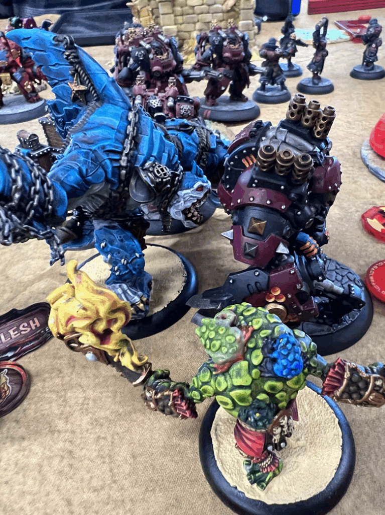 A close up of alien-looking miniatures in a variety of colors